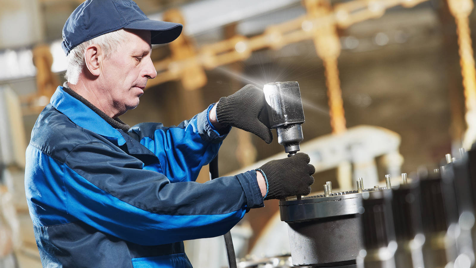 A parts assembly management worker assembling parts in a factory