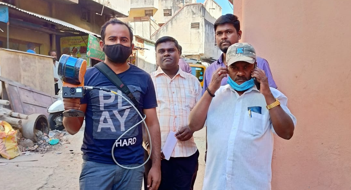 Group of people scanning an Indian street with a mobile LiDAR