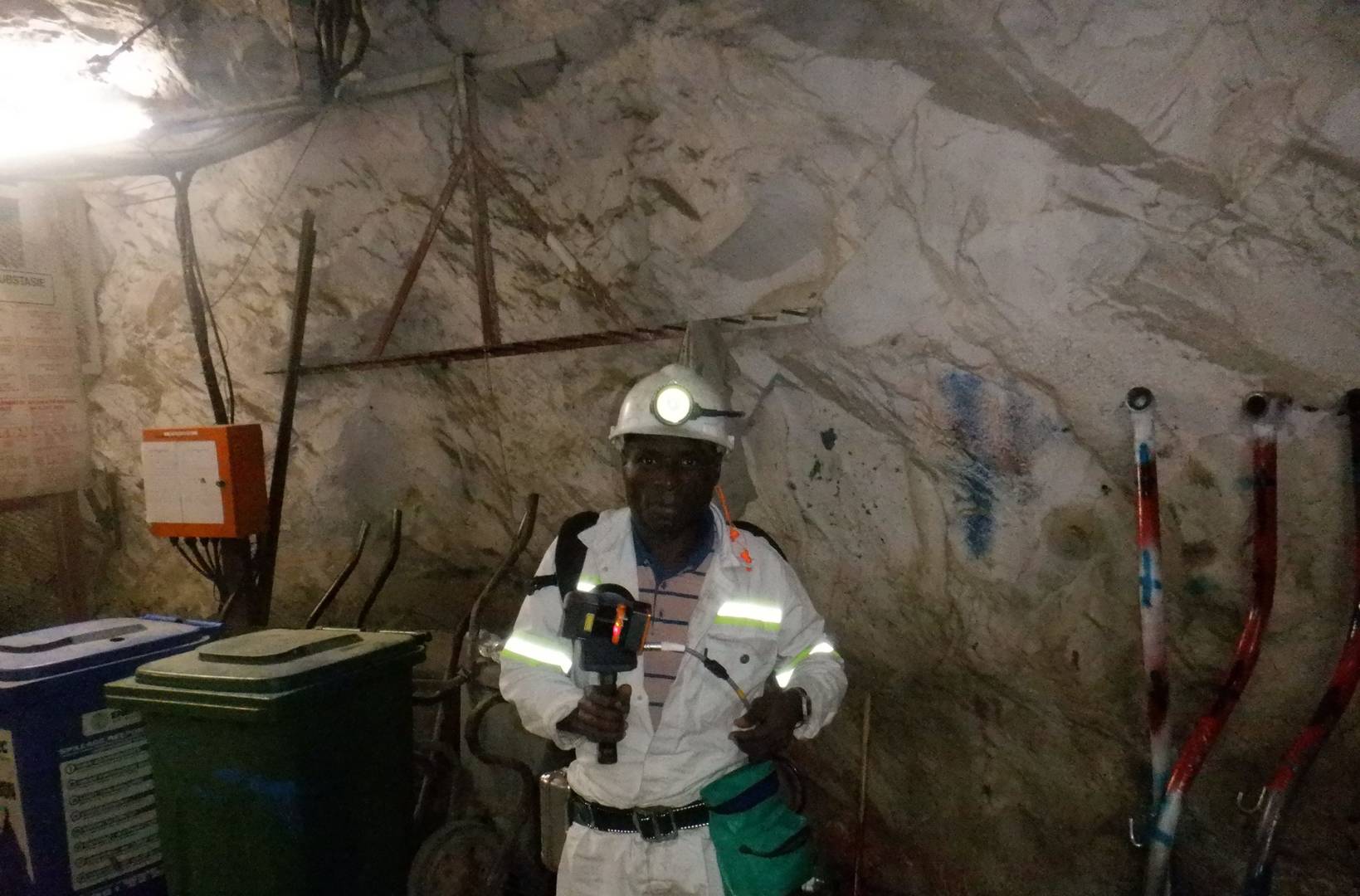 man posing with mobile LiDAR scanner underground