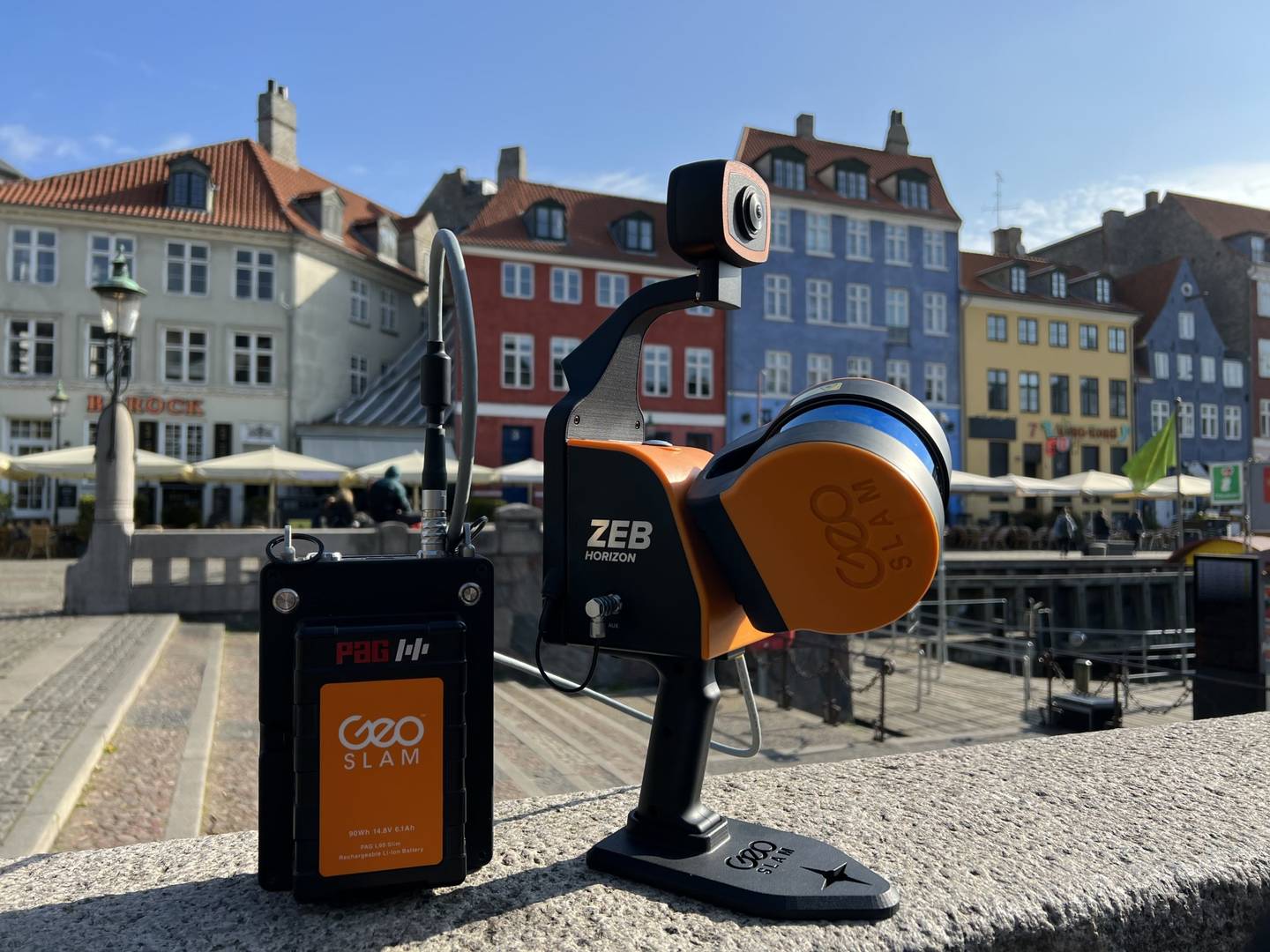 Mobile LiDAR scanner and 360-degree panoramic camera on a wall in front of Nyhavn in Denmark