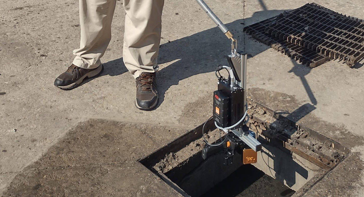 Mobile LiDAR solution on a pole being lowered down a drain